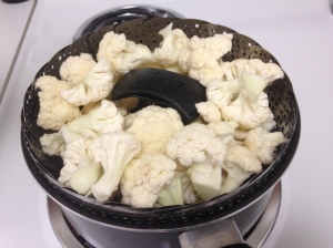 Cauliflower, garlic cloves, and salt in steamer with the pot filled 1-2 inches with water!