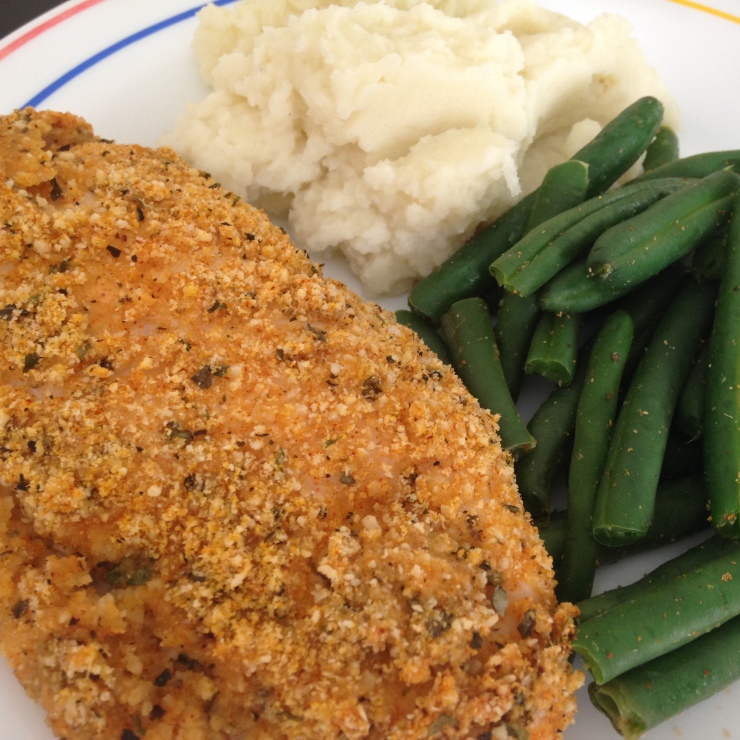 Almond crusted chicken breast served with steamed green beans and garlic mashed cauliflower.