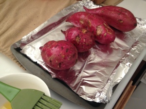 Using a cooking brush, coat the sweet potatoes with melted ghee or coconut oil. 