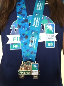 I DID IT. Rocking my half marathon finisher medal and shirt. I AM OFFICIALLY A HALF-MARATHONER!