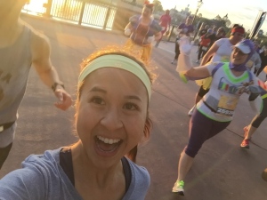 This is me. VERY HAPPILY RUNNING THROUGH EPCOT. Runner and Disney high at this point for sure.